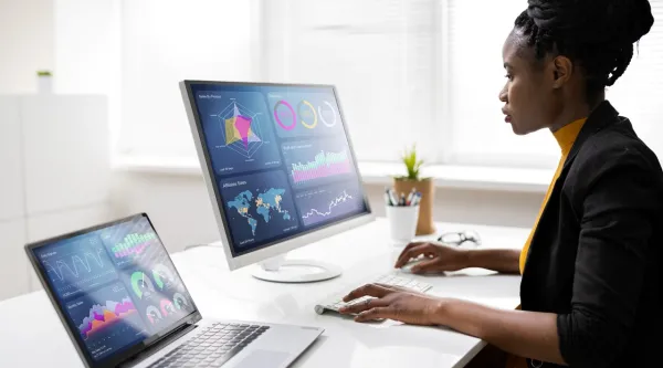 a woman looking at data on a computer