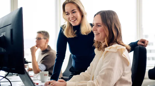 Two business women using computer