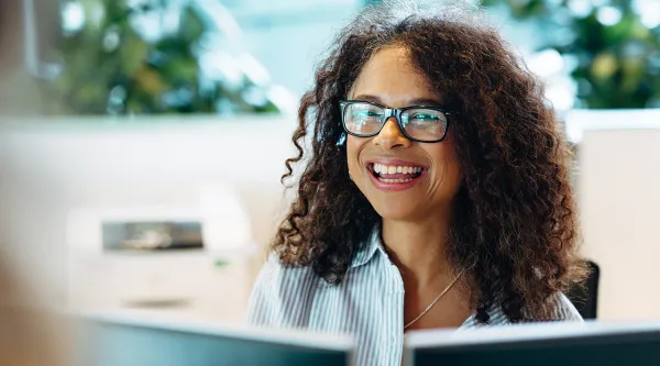 woman at computer smiling