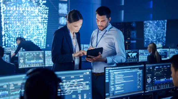 Cyber resilience consultants in computer room