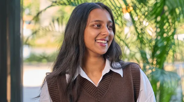 Close up shot of young man smiling directly at the camera