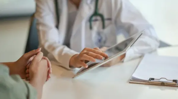 healthcare professionals talking with patient