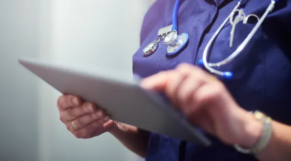 healthcare worker using tablet