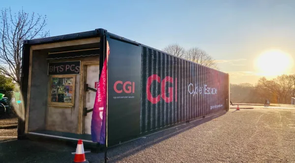 CGI Cyber Escape Experience container at sunset