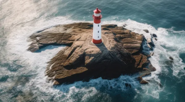 Lighthouse sitting on a rock out in the ocean