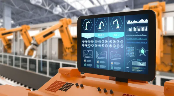 Digital screen showing robots completing an automated process on a factory floor.