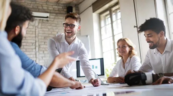 business process consultants talking round desk