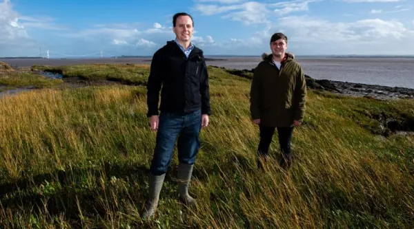 Two men stood in a seagrass meadow in the severn estuary