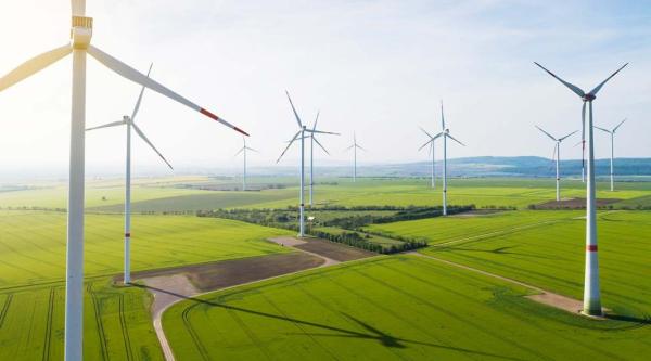 Wind farm on an open field creating renewable energy