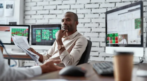 two traders discussing