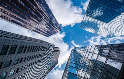 View of the sky between 4 buildings