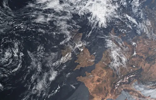 Satellite view of Western Europe showing the United Kingdom, Ireland, France, and surrounding…