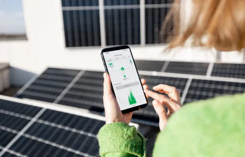 Woman monitoring energy production