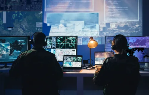 two people working in a control room