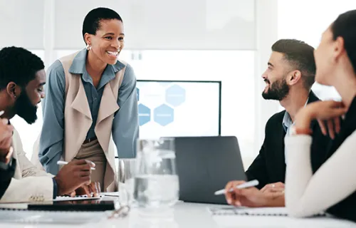 Group of employees talking in a meeting room