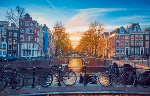 Amsterdam at sunset with houses and bridge