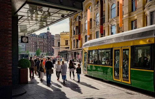Pedestrians and tram on city street in Helsinki Finland