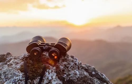 binoculars on a cliff