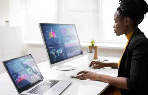 a woman looking at a computer 
