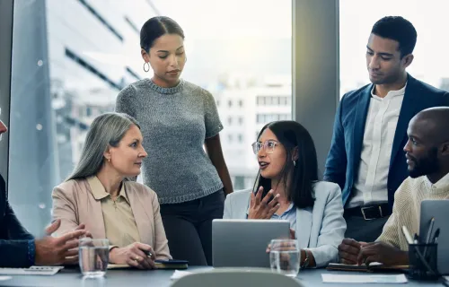 Business people using a digital tablet during a meeting