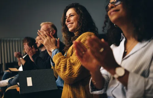 business_professionals_applauding_at_conneXion event