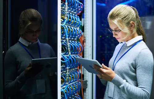Woman checking data on digital tablet