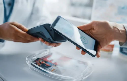 Person making payment using smart device