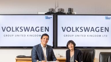 Tara McGeehan, President  - CGI and Michael Marr, CIO  - Volkswagen Group UK sitting side by side in a meeting