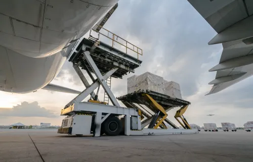 Cargo pallets being loaded into a large aircraft