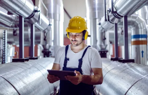 engineer using tablet in an industrial facility