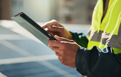 energy professional reviewing data on a tablet