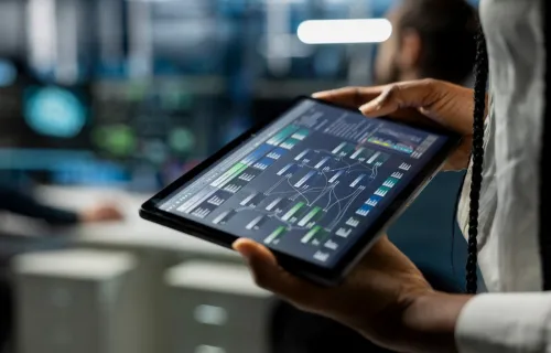 A close-up of data center developer running a simulation on a tablet
