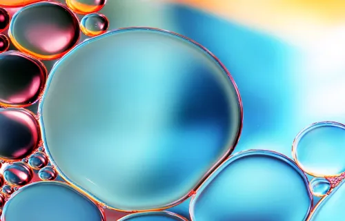 Close up of water droplets in blue and red light
