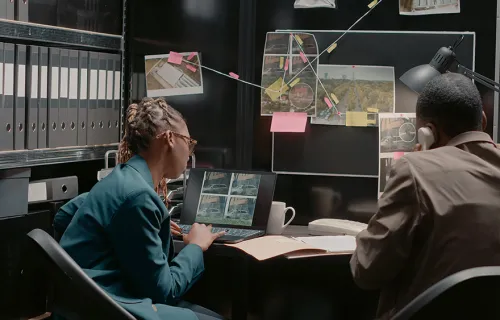 Two people in a command center