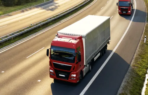Commercial fleet vehicle transporting goods by road