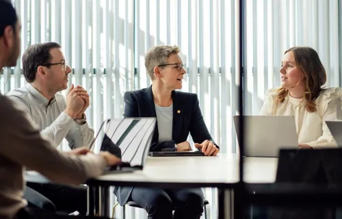 Cyber consultants sat around desk