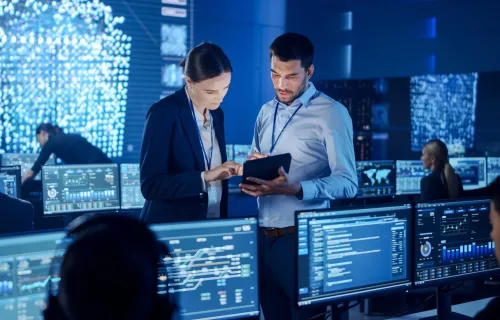 Cyber resilience consultants in computer room