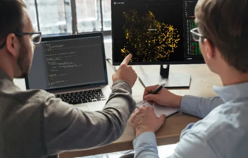 Cyber security consultant points at screen