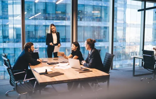 Cyber security consultants in discussion around a table
