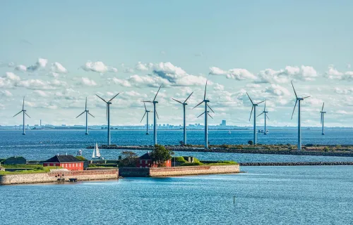 Danish Scandinavian wind farm in Copenhagen surrounded by water