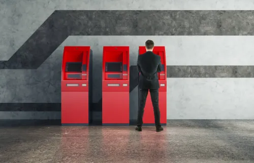 Man taking money at an ATM