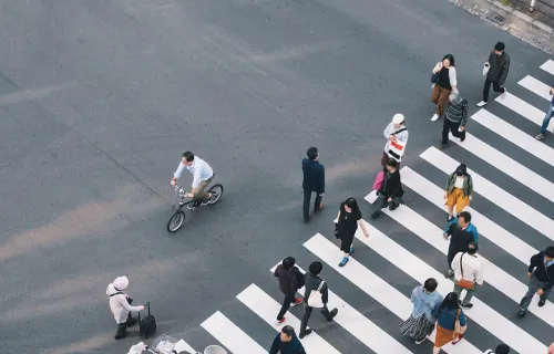 Diverse crowd crossing the street in a crosswalk
