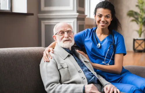 Doctor comforting elderly patient
