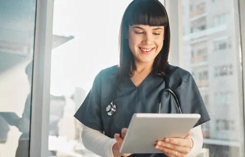 Doctor using tablet device