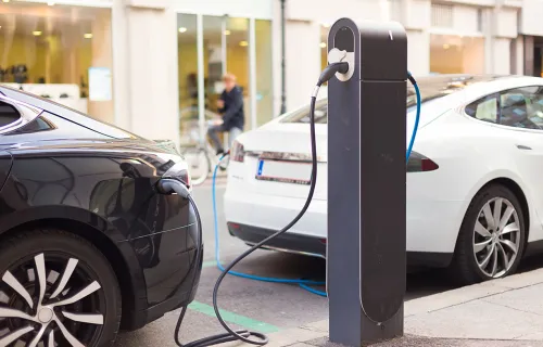 two electric vehicles charging