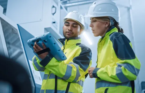 Engineer and project manager working with a tablet