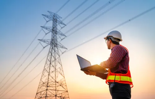 Engineer looks up at pylon