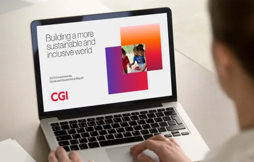 Laptop-Bildschirm mit der Aufschrift "Building a more sustainable and inclusive world"