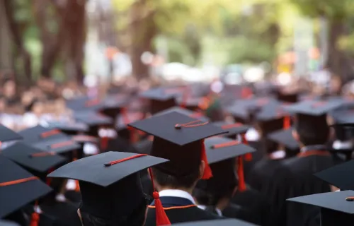 Graduates in a crowd for graduation