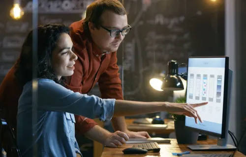 two people looking at a computer screen